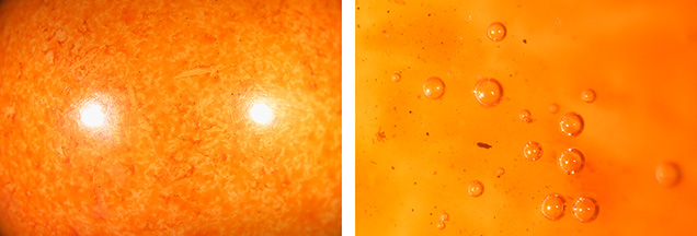 Figure 3. Microscopic observation of the 89.81 ct sphere revealed unnatural color patches (left) and gas bubbles and trapped dirt (right). Photomicrographs by Ravenya Atchalak; fields of view 19.20 and 1.80 mm. Figure 3. Microscopic observation of the 89.81 ct sphere revealed unnatural color patches (left) and gas bubbles and trapped dirt (right). Photomicrographs by Ravenya Atchalak; fields of view 19.20 and 1.80 mm.