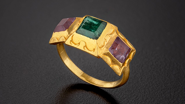 Figure 3. An emerald and amethyst gold ring recovered from the shipwreck. Photo by Robert Weldon. Figure 3. An emerald and amethyst gold ring recovered from the shipwreck. Photo by Robert Weldon.