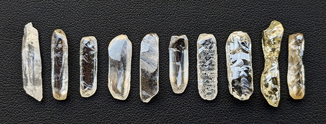Figure 3. Elongate rough diamonds reminiscent of baguette cuts, ranging from 1.84 to 7.10 ct in weight and 16 to 24 mm in length. Photo by Evan M. Smith.