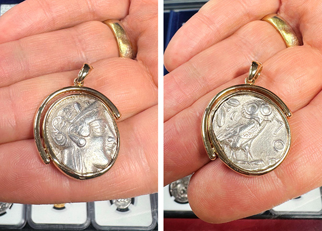 A hand holds a pendant featuring a coin with a detailed face on one side and an owl on the other, framed in gold. A hand holds a pendant featuring a coin with a detailed face on one side and an owl on the other, framed in gold.