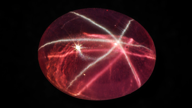 Pink synthetic sapphire with white star and pink star Pink synthetic sapphire with white star and pink star