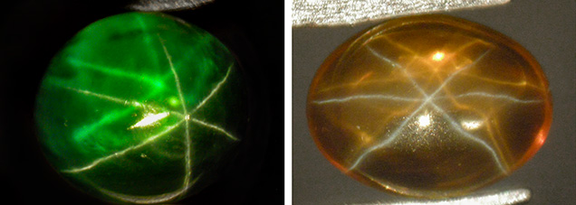A green and an orange synthetic sapphire cabochon, both with dual-color double asterism A green and an orange synthetic sapphire cabochon, both with dual-color double asterism