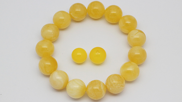 Steam-dyed amber beads and bracelet. Steam-dyed amber beads and bracelet.