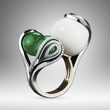 One-of-a-kind ring featuring two emerald beads and one tagua seed bead. One-of-a-kind ring featuring two emerald beads and one tagua seed bead.