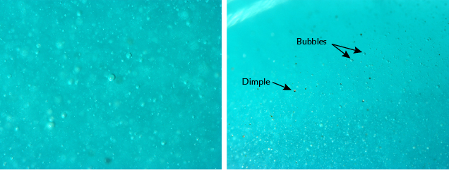 Greenish blue glass cabochon samples feature internal gas bubbles and surface dimples. Greenish blue glass cabochon samples feature internal gas bubbles and surface dimples.