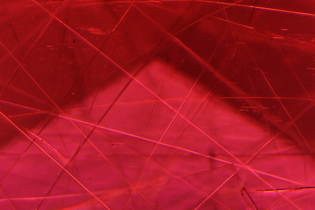 Scattered needle-like inclusions are likely cummingtonite. Scattered needle-like inclusions are likely cummingtonite.