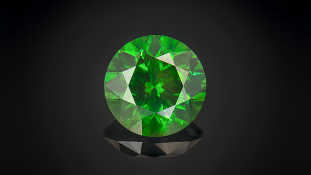 Figure 15. A 10.02 ct Russian demantoid garnet. Photo by Robert Weldon; courtesy of Pala International. Figure 15. A 10.02 ct Russian demantoid garnet. Photo by Robert Weldon; courtesy of Pala International.