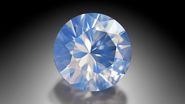 Figure 18. A 0.68 ct faceted Slovak Ice Opal measuring 6 mm. Photo by Albert Russ; courtesy of Great Rent JSC Figure 18. A 0.68 ct faceted Slovak Ice Opal measuring 6 mm. Photo by Albert Russ; courtesy of Great Rent JSC