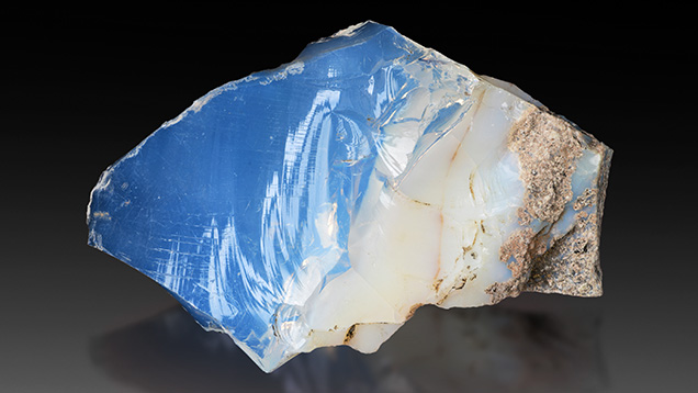 Figure 8. Glassy and milky common opal (42 × 28 × 17 mm). Photo by Albert Russ; courtesy of Great Rent JSC. Figure 8. Glassy and milky common opal (42 × 28 × 17 mm). Photo by Albert Russ; courtesy of Great Rent JSC.
