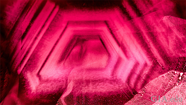 A hexagonal cloud results from heat treating this Burmese ruby from Mong Hsu. Field of view 2.97 mm. A hexagonal cloud results from heat treating this Burmese ruby from Mong Hsu. Field of view 2.97 mm.