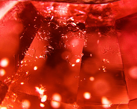Synthetic overgrowth on Be-diffused sapphire. Synthetic overgrowth on Be-diffused sapphire.