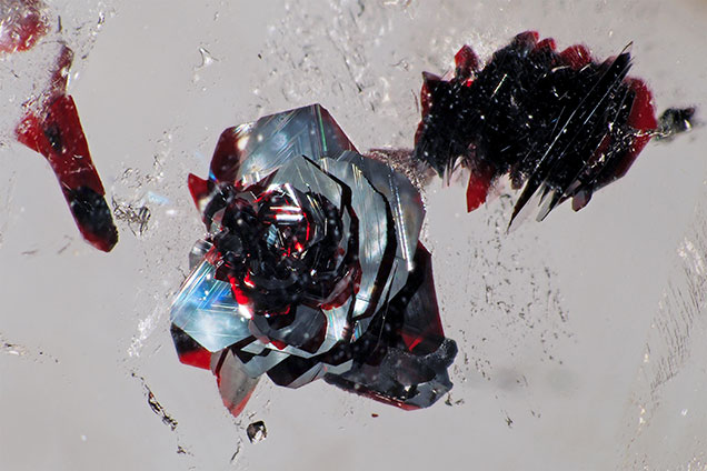Hematite platelet in “rose” inclusion.