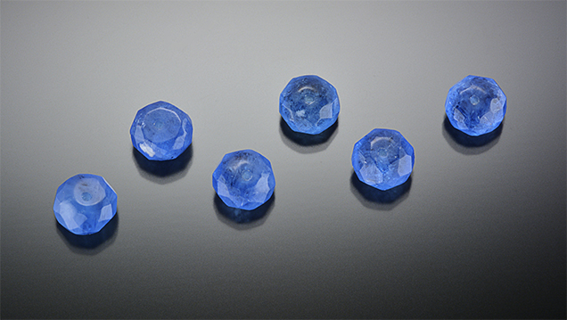 Faceted manufactured glass beads. Faceted manufactured glass beads.