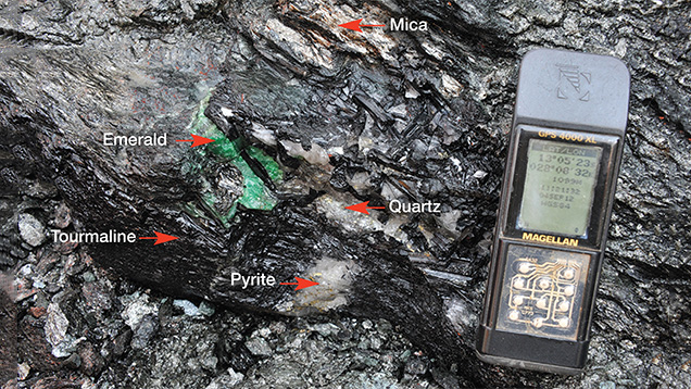 Emerald associated with black tourmaline, quartz, mica, and pyrite