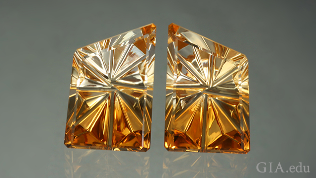 Two pieces of carved citrine that show light to dark from top to bottom.