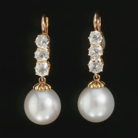 Pearl earrings, such as these American 14K gold, diamond and cultured pearl earrings, should be cleaned using an unused makeup brush and warm, soapy water. Photo by David Behl, © Janet Mavec & GIA.