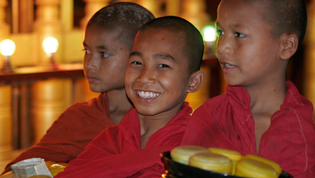 Monks in red robes are seen throughout Myanmar. Photo by Andy Lucas, ©GIA.