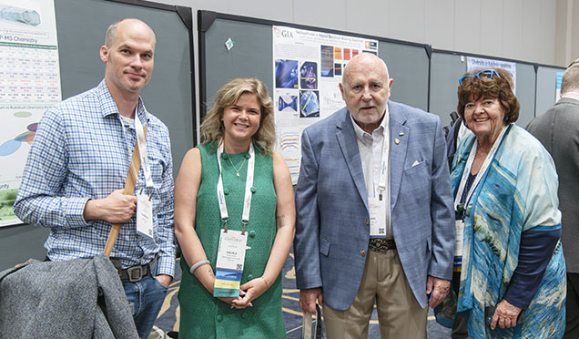 Figure 1. On hand to interact with Converge poster session attendees, GIA’s Nathan Renfro, Nicole Ahline, John Koivula, and librarian emerita, Dona Dirlam represent a wealth of gemological and geo-literary experience. Photo by Emily Lane.