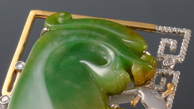 This ring features jadeite and diamonds set in 14K gold. A dragon and a phoenix are intertwined. In China, the dragon and phoenix once represented the emperor and empress, but now they are symbols of partnership between a successful and powerful man and woman. The ring symbolises the strong willpower of the wearer. - Courtesy Wang Yue-Yo Creative Jewelry Design