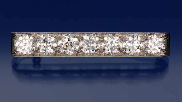 This Tiffany & Co. brooch contains seven diamonds with an approximate total weight of five carats. They’re very well-matched, “transitional” round brilliants, with the smaller table facets (52 to 54 percent); short lower half facets; and culet sizes typical of cuts created during the period from 1870 to 1950. Photo by Robert Weldon, © GIA