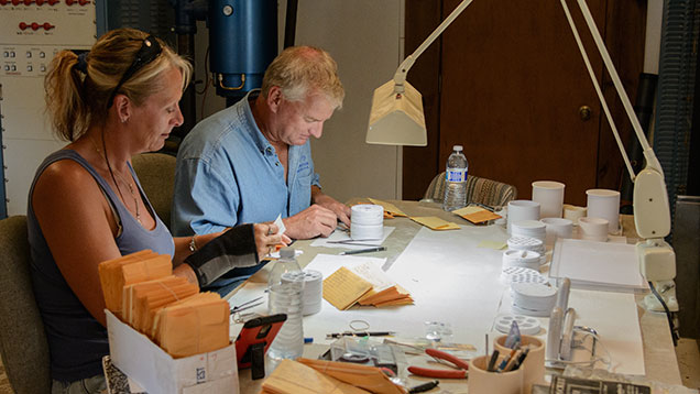 Man and woman working on clients’ stones