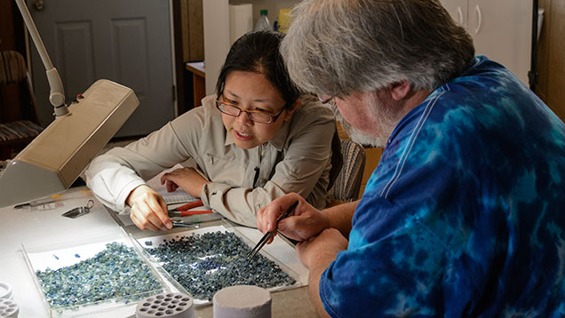 Man and woman checking sapphire colors