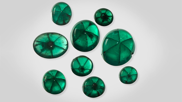 These trapiche emeralds, all from Peñas Blancas, range from 5.09 to 22.74 carats. Photo by Robert Weldon/GIA. Courtesy of Jose Guillermo Ortiz, Colombian Emerald Co.