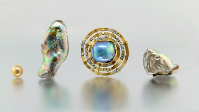 Three unique abalone pearls are shown alongside a typical 12 mm golden South Sea bead-cultured pearl for comparison.