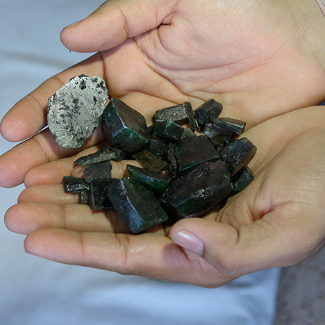 Handful of emerald rough