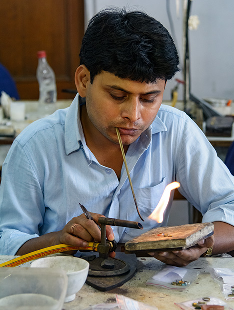 Jeweler with blowpipe