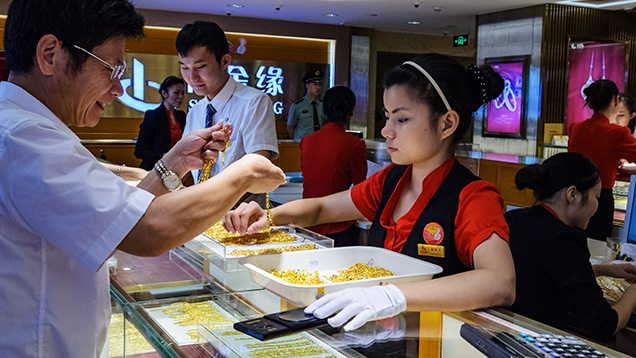 Shopper shopping for gold jewelry