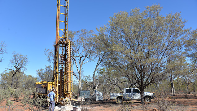 Auger drill in the field