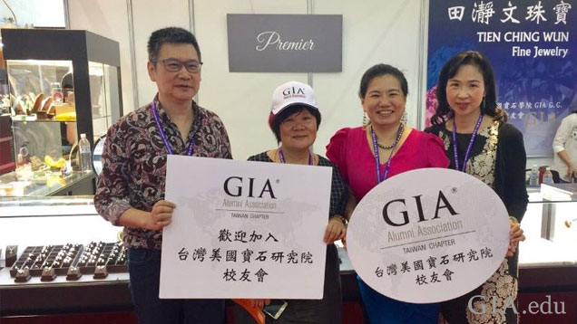 Taiwan members share pride in their chapter at a recent trade fair. Photo courtesy of the Taiwan chapter