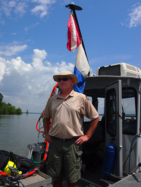 Man standing on a diving boat