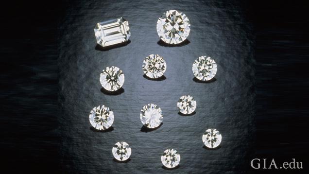 A group of 11 pieces of cut and polished moissanite. All round brilliants, except for one emerald cut.