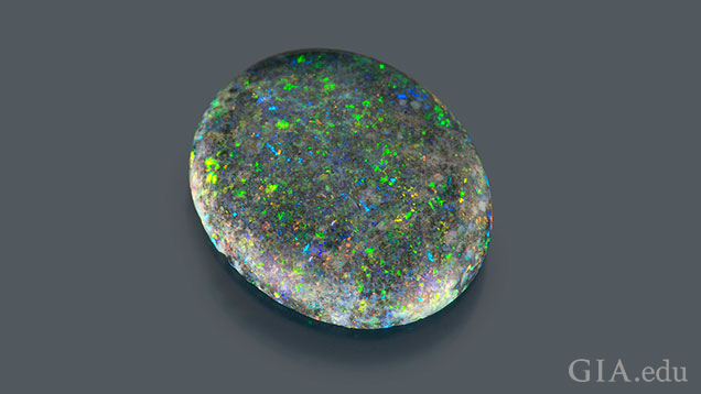 A 1.7 ct oval opal with “pinfire” flecks of color.