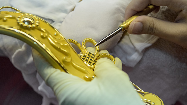 Wax carver creates intricate details for jewelry pieces