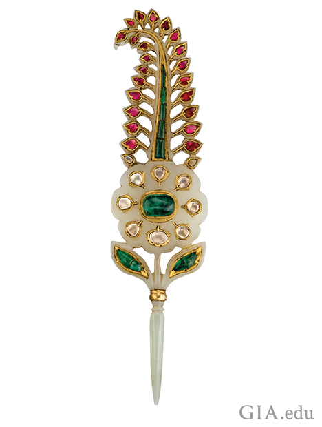 Ornament in the shape of a feature made of jewels with a pointed blade toward the bottom of the piece