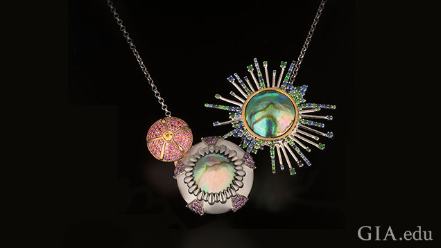 This urchin necklace is composed of two Eyris pearls accented with blue, pink and yellow sapphires, tsavorite garnets and amethysts.