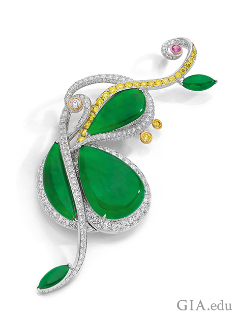 Brooch is styled as a cello, with the body in green jadeite that is framed in yellow and colorless diamonds.