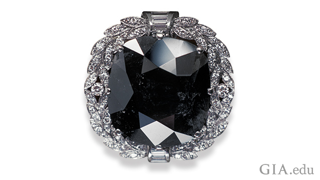 Image of Black Orloff diamond in a white gold setting surrounded by melee diamonds