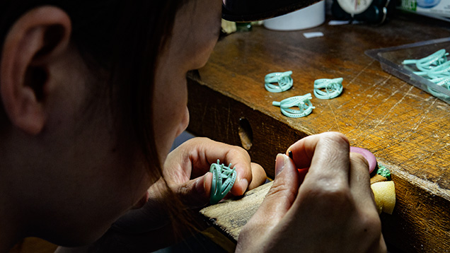 Worker placing diamonds in max models