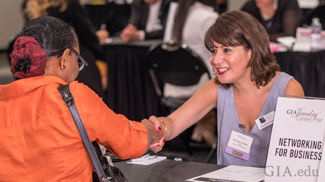 Michelle Orman shakes the hand of an eager job seeker during the one-on-one career coaching sessions.