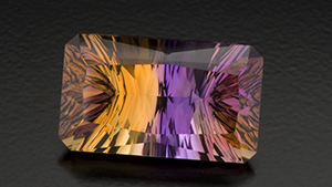 Concave facets on the pavilion contribute to the striking look of this 27.50 ct. ametrine. Creative gem cutters sometimes use concave facets to give a gem a dramatic appearance. – Robert Weldon, courtesy Minerales y Metales del Oriente
