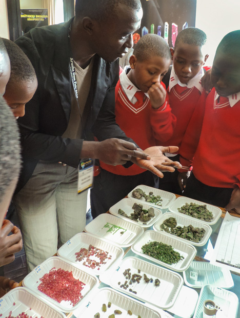 Students from Arusha Secondary School tour the 2015 Arusha Gem Fair after the GemKids programme. Photo by GIA