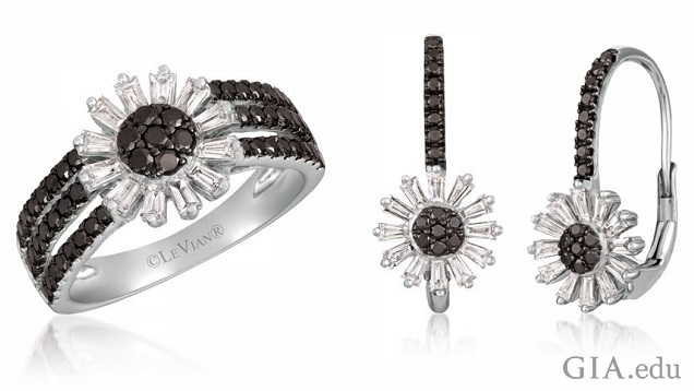 The ring is comprised of a sunflower motif with a black diamond center and colorless diamonds petals that sits on three bands of black diamonds. The sunflower motif, same as the ring, sits at the end of a row of black diamonds. 