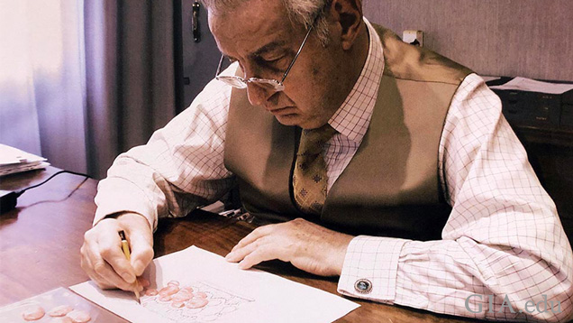 Gianmaria Buccellati hand sketching a jewelry design on paper.