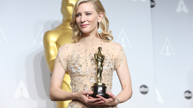 The Best Actress winner Cate Blanchett stunned in white opal and diamond chandelier earrings by Chopard. Photo courtesy of JoeSeer/ Shutterstock.com