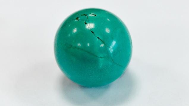 Dyed and impregnated turquoise.