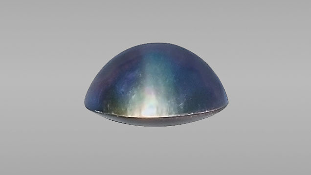 Blue-violet assembled cultured blister pearl.